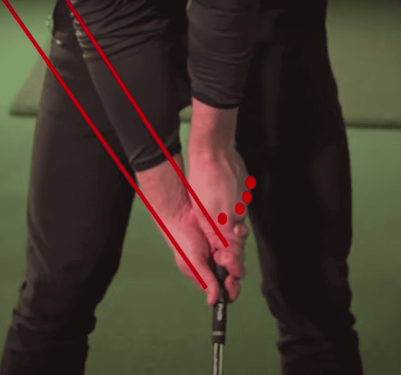 Ultra Strong Golf Grip. The lines pointing way outside the body indicates a very strong golf grip.